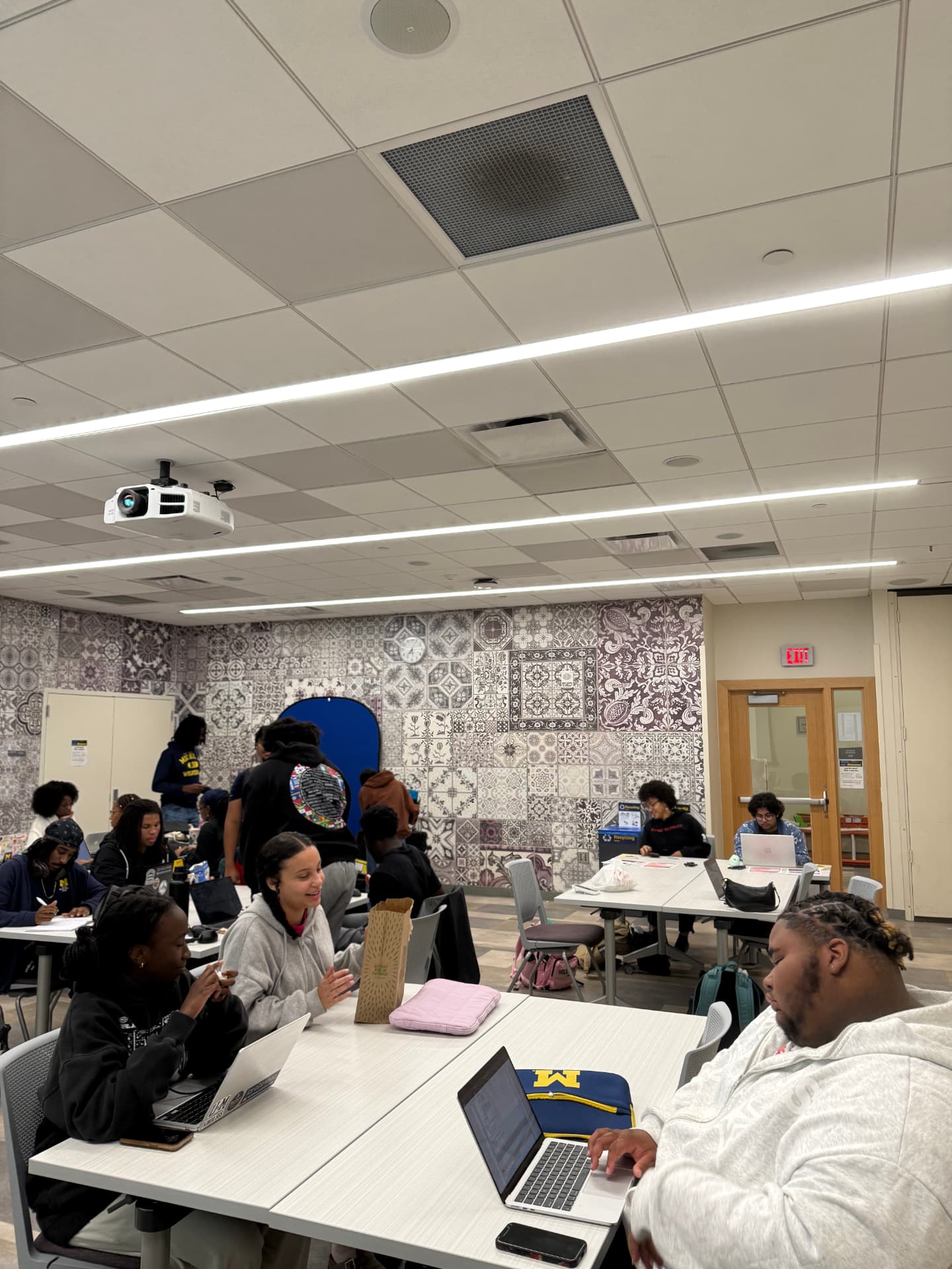 Students working together at tables during a BSU community study night at Trotter