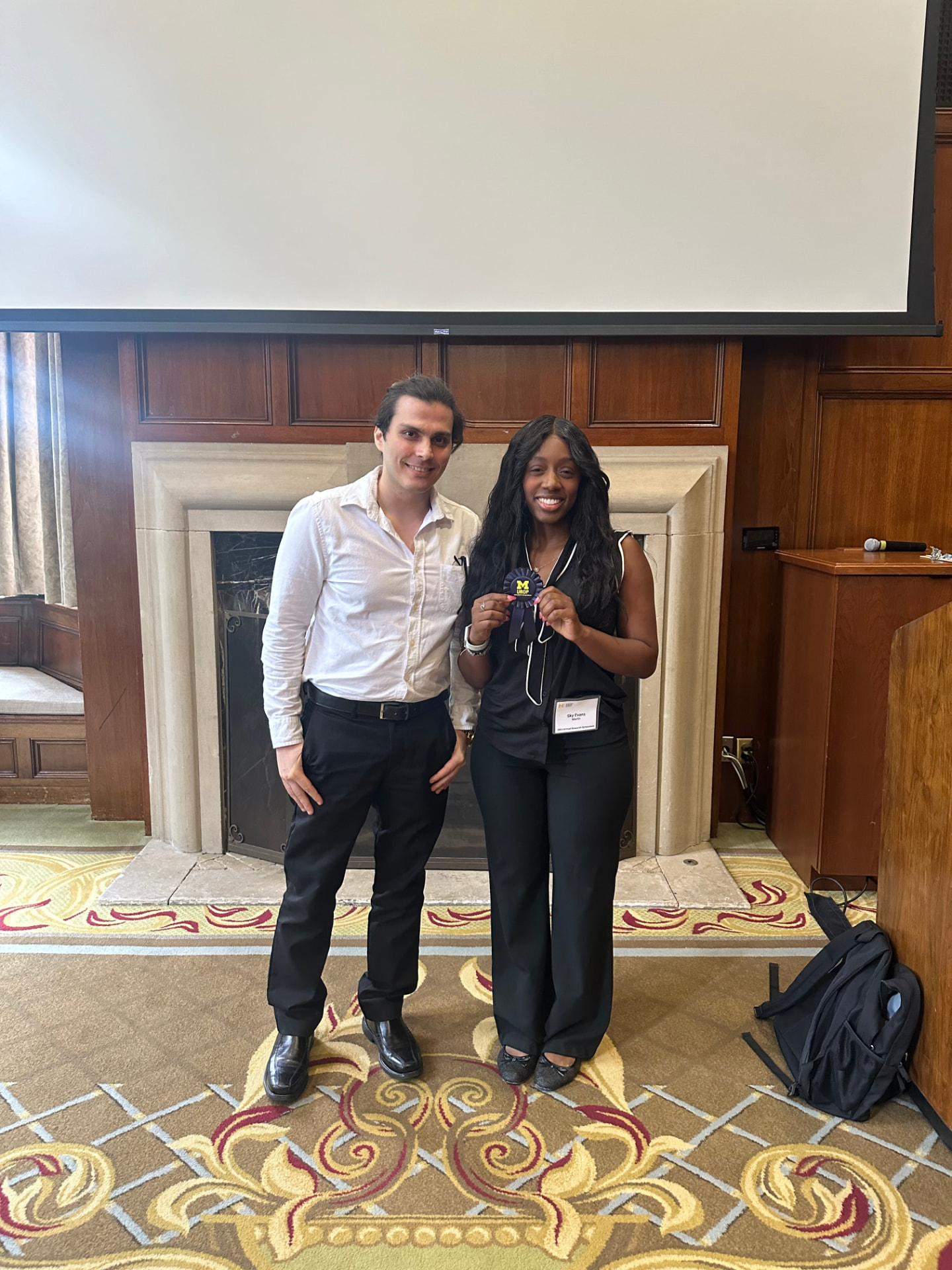 Sky receiving the Blue Ribbon award at the Summer Research Symposium